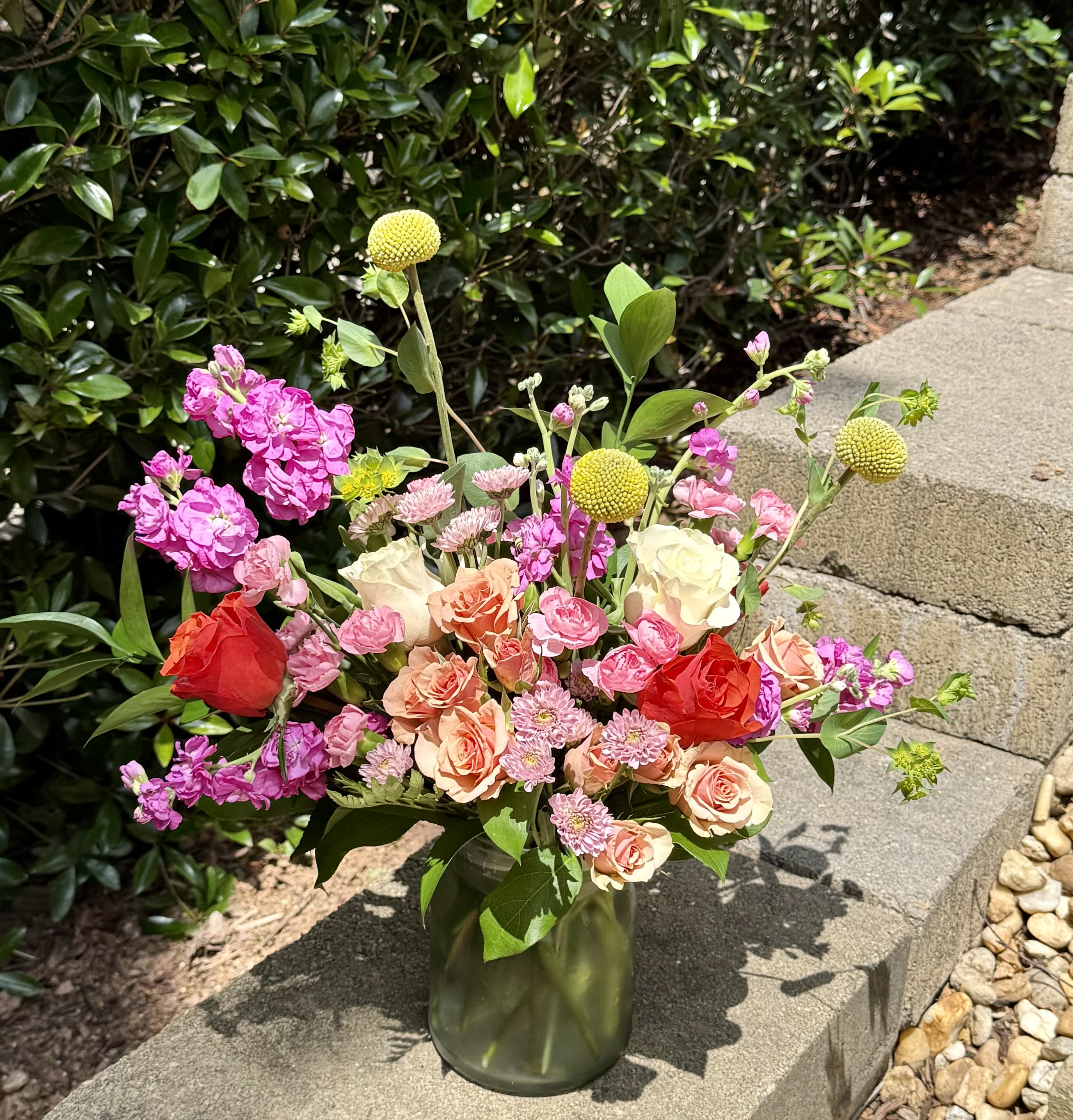Peachy Daydream - A dreamy blend of soft pastels brought to life with bright orange roses—like a gentle daydream with a vibrant twist.