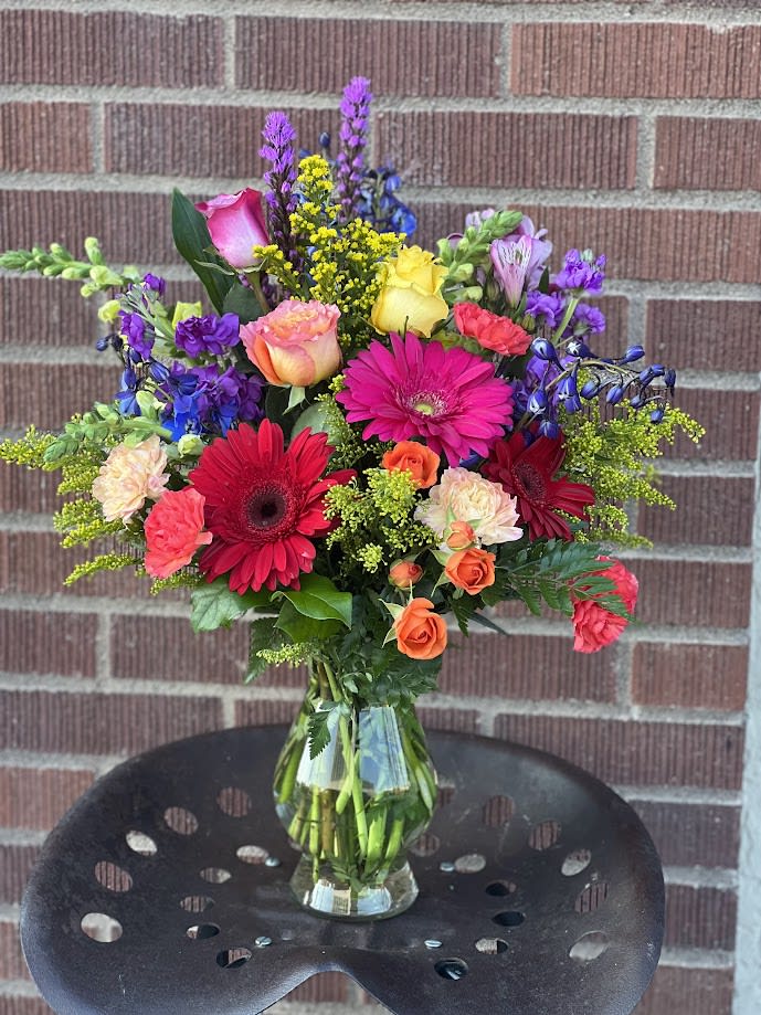 Colorful mixed bouquet in a clear glass vase