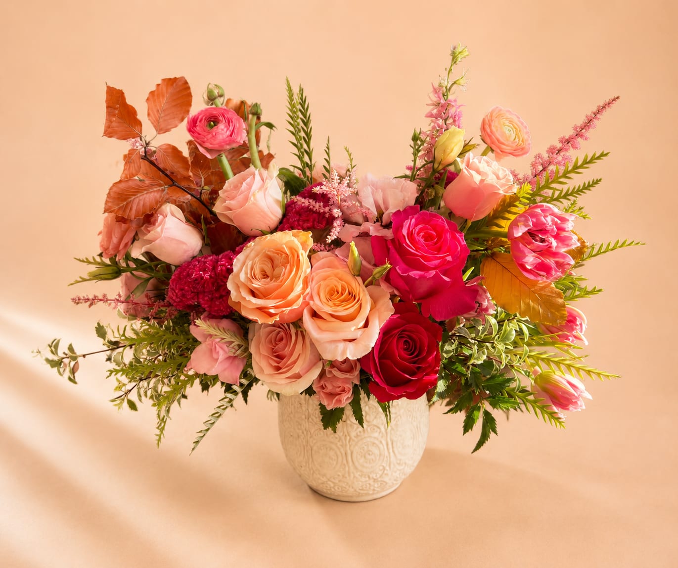Happy Wife Happy Life  - Flowers: cherry-o roses, coral garden roses, shimmer peach roses, frutetto roses, pink lisianthus, pink coxxcomb, pink tulips, coral pink ranunculus, grevillea, italian pittosporum, and touches of pink larkspur.   Designed in our 6.5" Francis Pot  