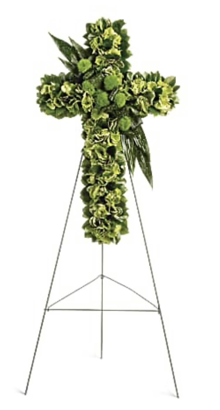 Green floral cross on a metal stand