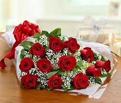 Bouquet of red roses with baby's breath wrapped in white paper