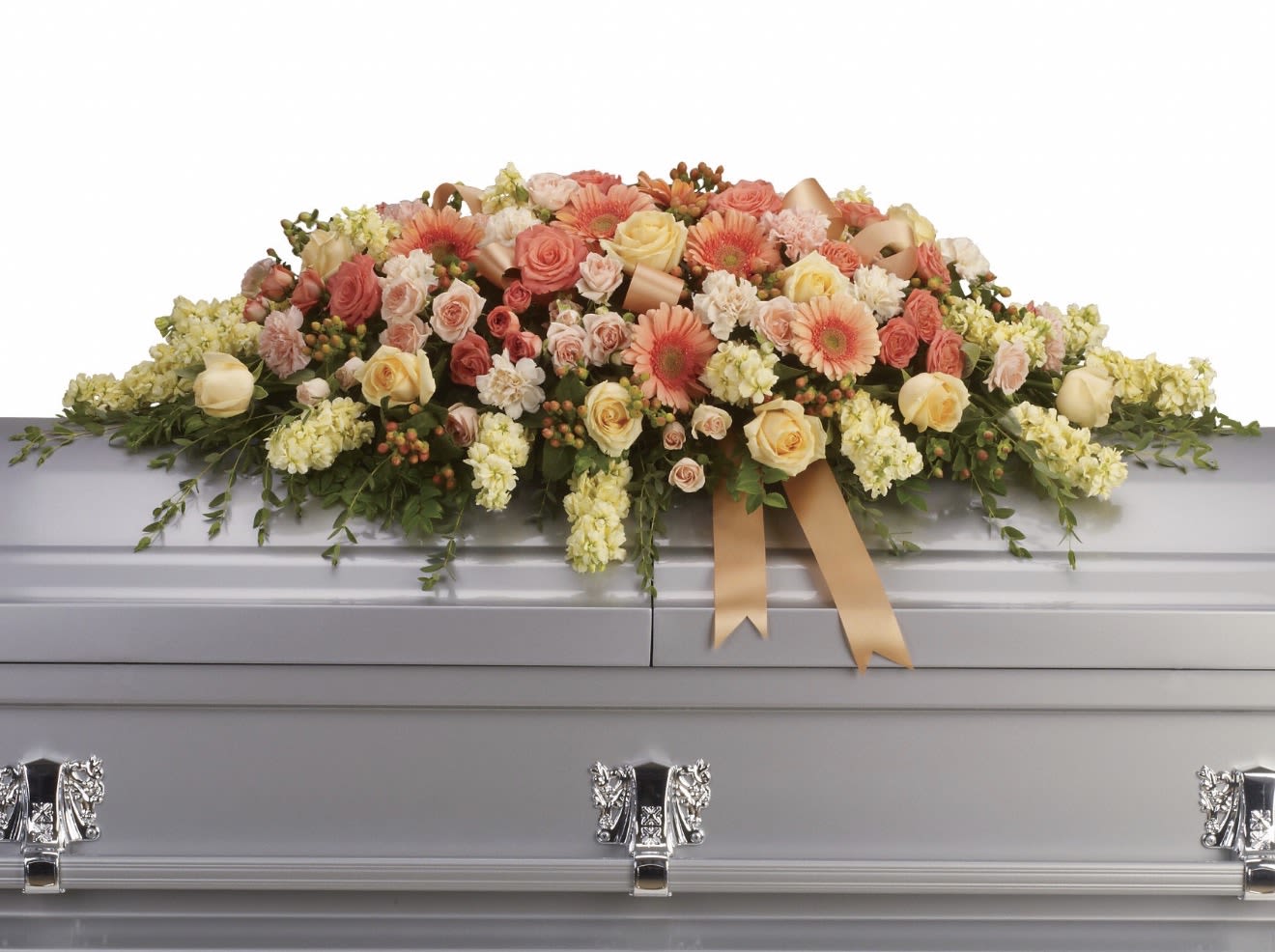 Warmest Remembrance Casket Spray - A soft cascade of pastel roses, gerbera daisies, and clustered blooms creates a gentle, comforting statement for a funeral or sympathy service. This large casket spray is designed specifically for memorial use, offering a low, broad profile that lays gracefully across the top of a silver casket and reads as both respectful and tender. The arrangement's pink, peach, cream, and pale yellow palette conveys warmth and remembrance-an elegant way to honor the person you're thinking of.  Built with roses, gerbera daisies, carnations and small clustered filler flowers, the composition is full and rounded with delicate trailing greenery that softens the edges and adds subtle movement. Satin ribbon accents are woven through the flowers for a refined finish that complements formal services. The spread covers the casket top with a low silhouette to maintain a solemn presentation while still feeling intimate and lovingly arranged.  Made to comfort those left behind, this spray suits family members, close friends, or anyone wishing to send a message of sympathy and remembrance. Please note sizing and placement details when ordering so we can ensure proper fit for the casket; care and handling will be managed by our team to present the arrangement at its freshest for the service.