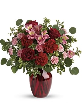 Red and pink bouquet in a red vase