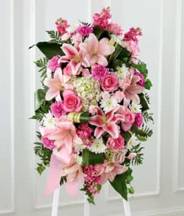 Pink and white floral standing spray with lilies and roses