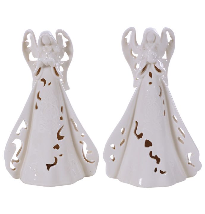 Pair of white ceramic angel figurines with cutout details on their long robes