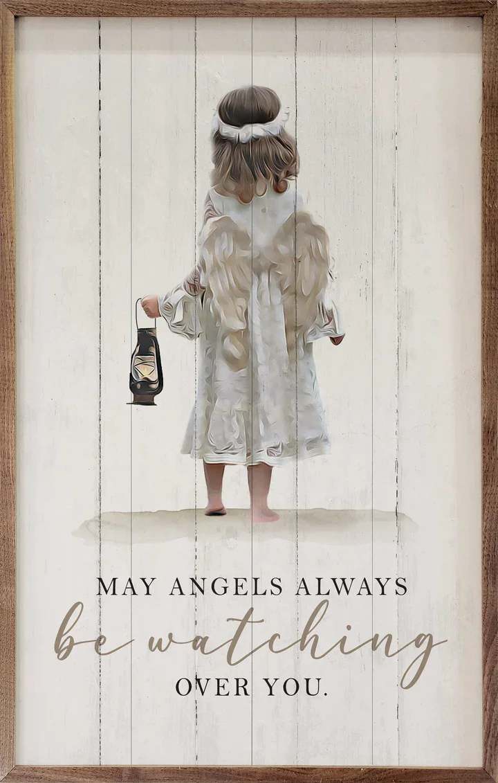 Wood-framed wall art of a childlike angel holding a lantern with the words may angels always be watching over you.
