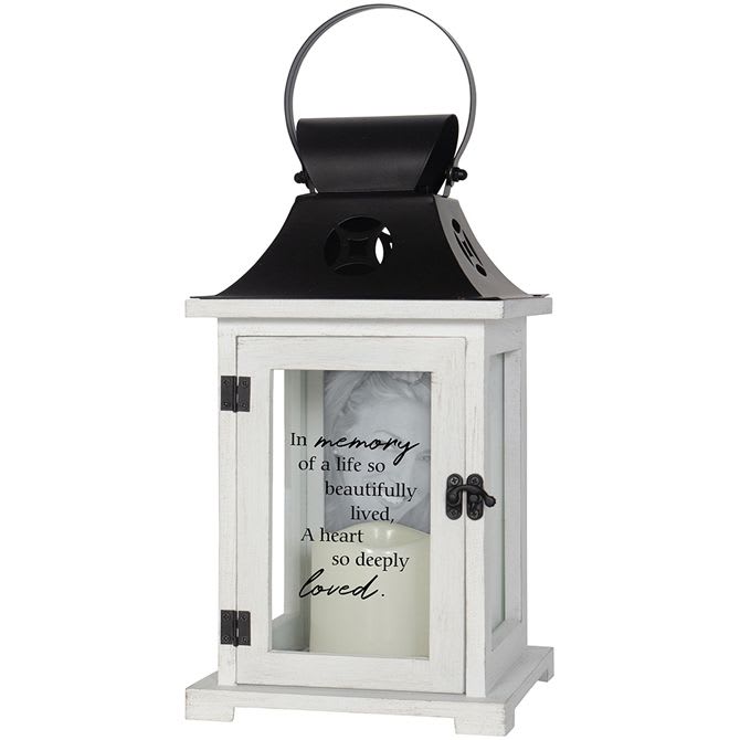 White memorial lantern with black metal top and remembrance verse on the glass door.