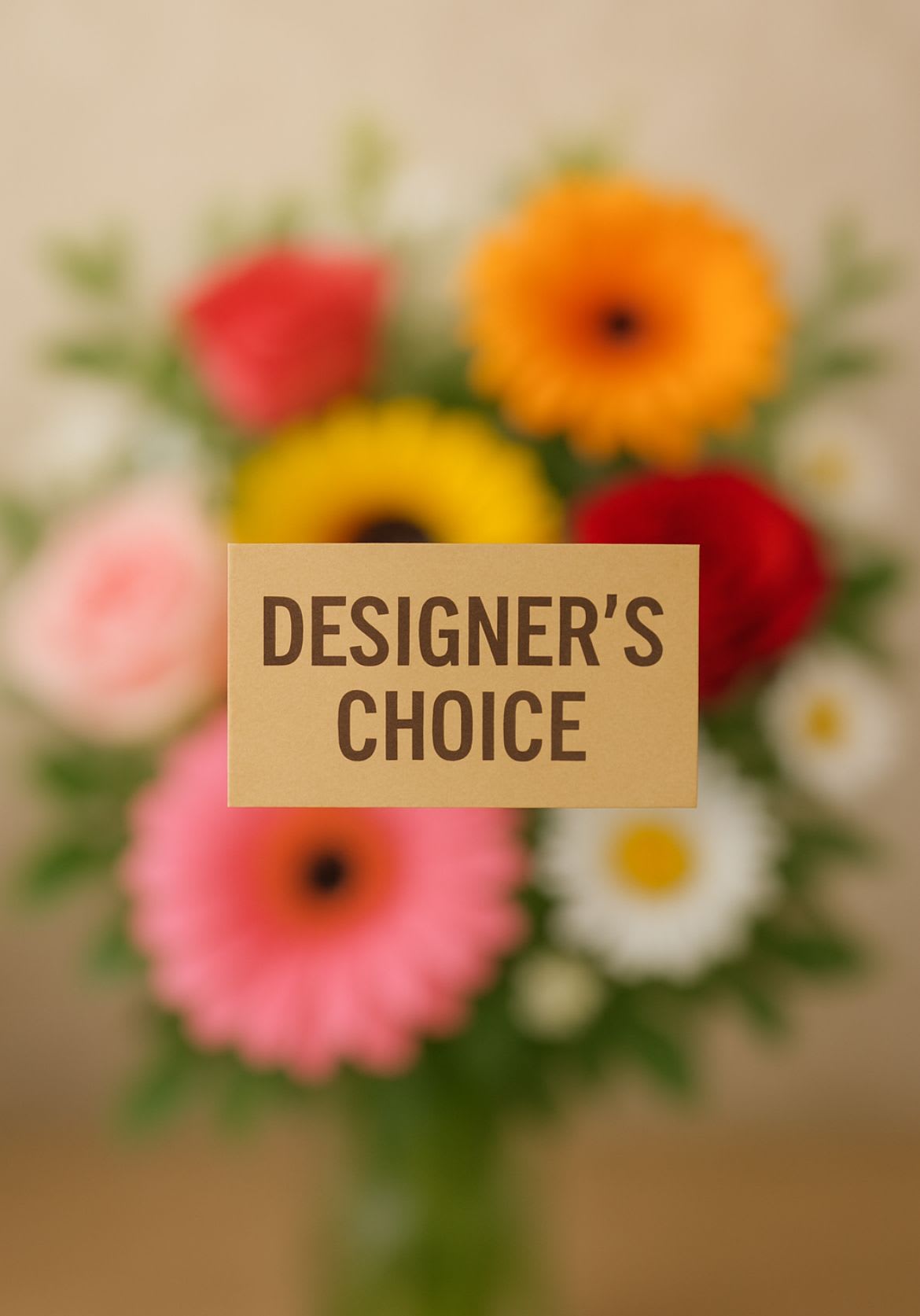 Designer's Choice Vase Arrangement - Let our expert florists create something truly special just for you! With our Designer’s Choice Vase Arrangement, we hand-select the freshest seasonal blooms to craft a unique design full of color, texture, and beauty. No two arrangements are ever the same — each one is thoughtfully styled to reflect the best flowers available that day.  Perfect for birthdays, celebrations, or simply to brighten someone’s day, this arrangement showcases our florist’s creativity and passion for design. Presented in a stylish glass vase, it arrives ready to display and enjoy.  Includes: A fresh, custom mix of seasonal flowers Handcrafted by our floral designers Arranged in a clear glass vase  Trust our designers to make something beautiful — a one-of-a-kind bouquet designed with care and creativity.