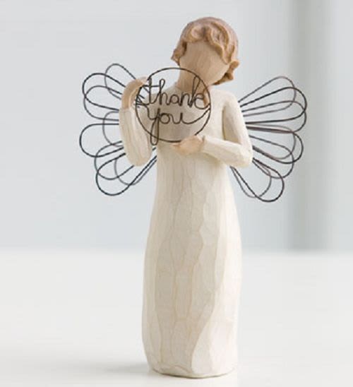 Angel figurine holding a "thank you" sign