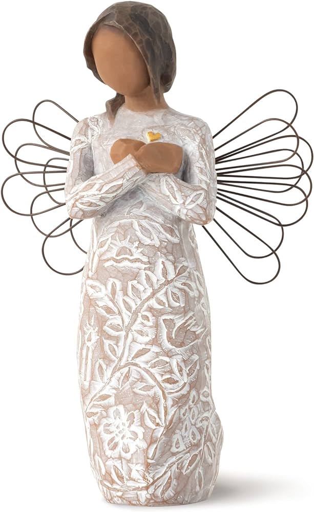 Angel figurine in a white patterned dress with wire wings