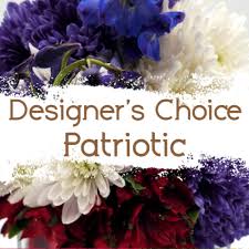 Designer's Choice - Patriotic Arrangement - We will use red, white and blue flowers to create a patriotic arrangement. A variety of containers may be used from vase to basket to wooden box. Please specify if you have preferences. 