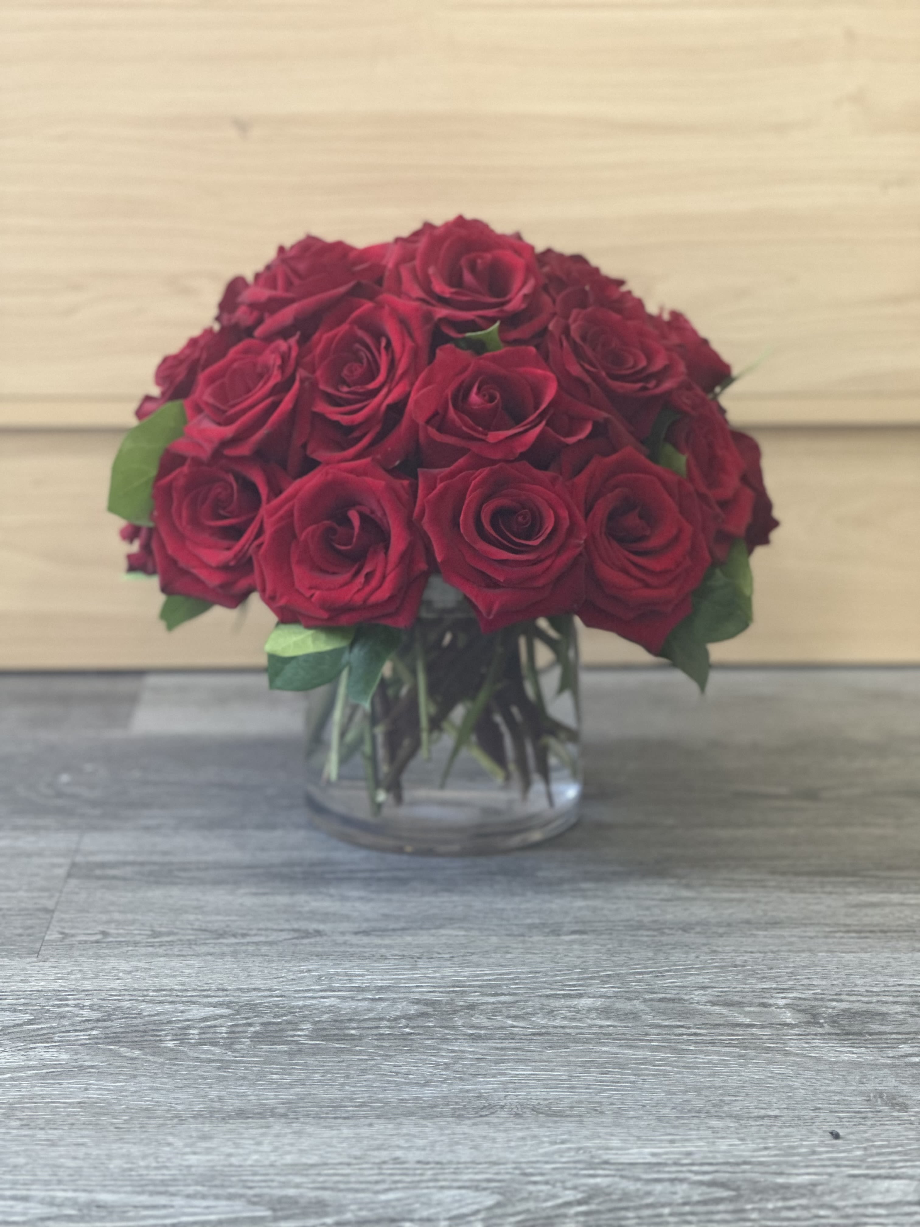 Bouquet of red roses in a clear glass vase