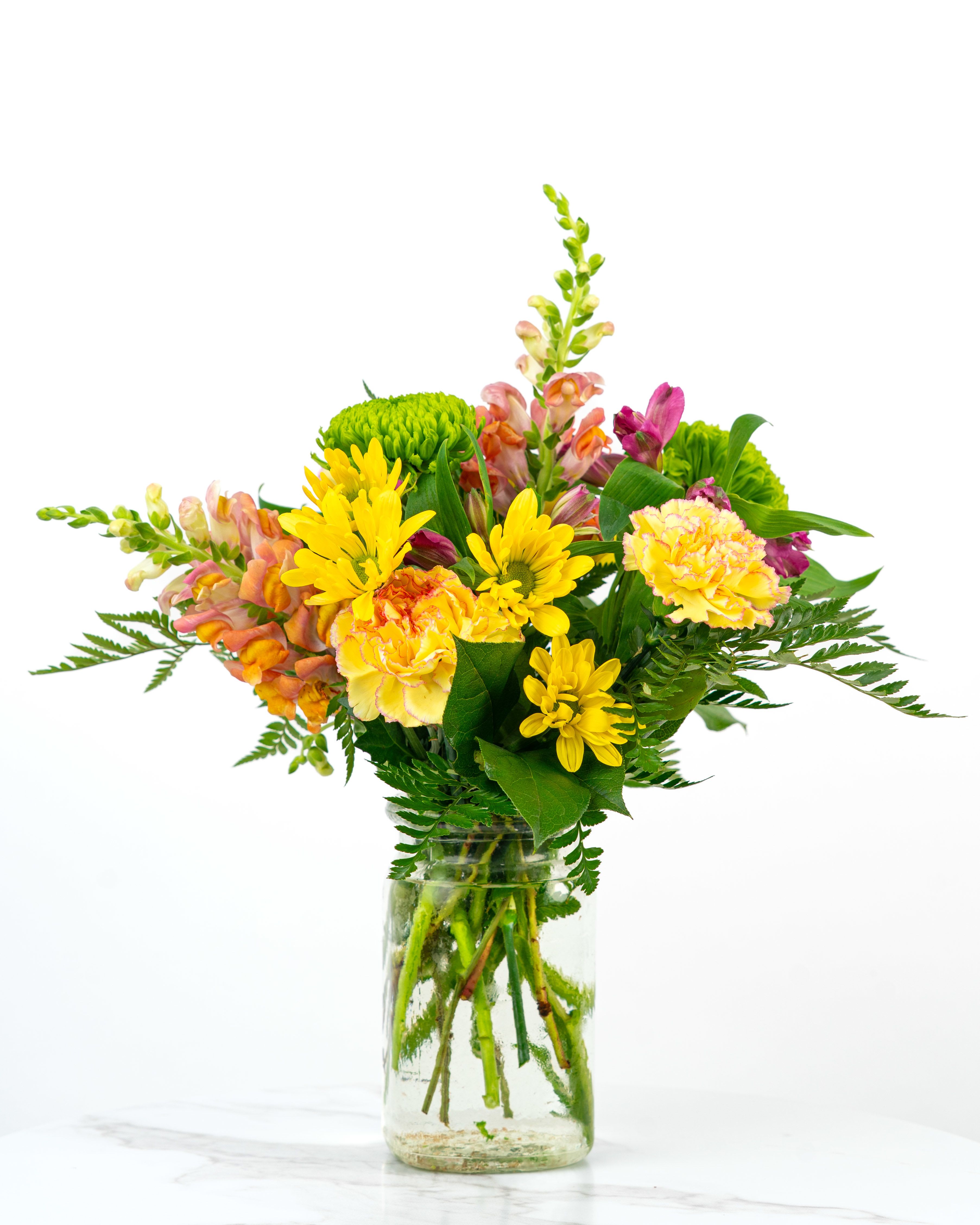 Our Birthday Collection: Florist's Surprise - Let our floral design team send birthday wishes with a color and style chosen based on our best premium blooms. At Schultz Floral, each arrangement is one of a kind and styled just for your order. Because we always use the freshest blooms, your final arrangement may not look exactly as pictured due to seasonal availability. Rather, a Florist's Birthday Surprise is intended to celebrate creativity and artful color combinations. Happy Birthday!  This is a top seller in Valparaiso, Chesterton, and Kouts (Indiana).