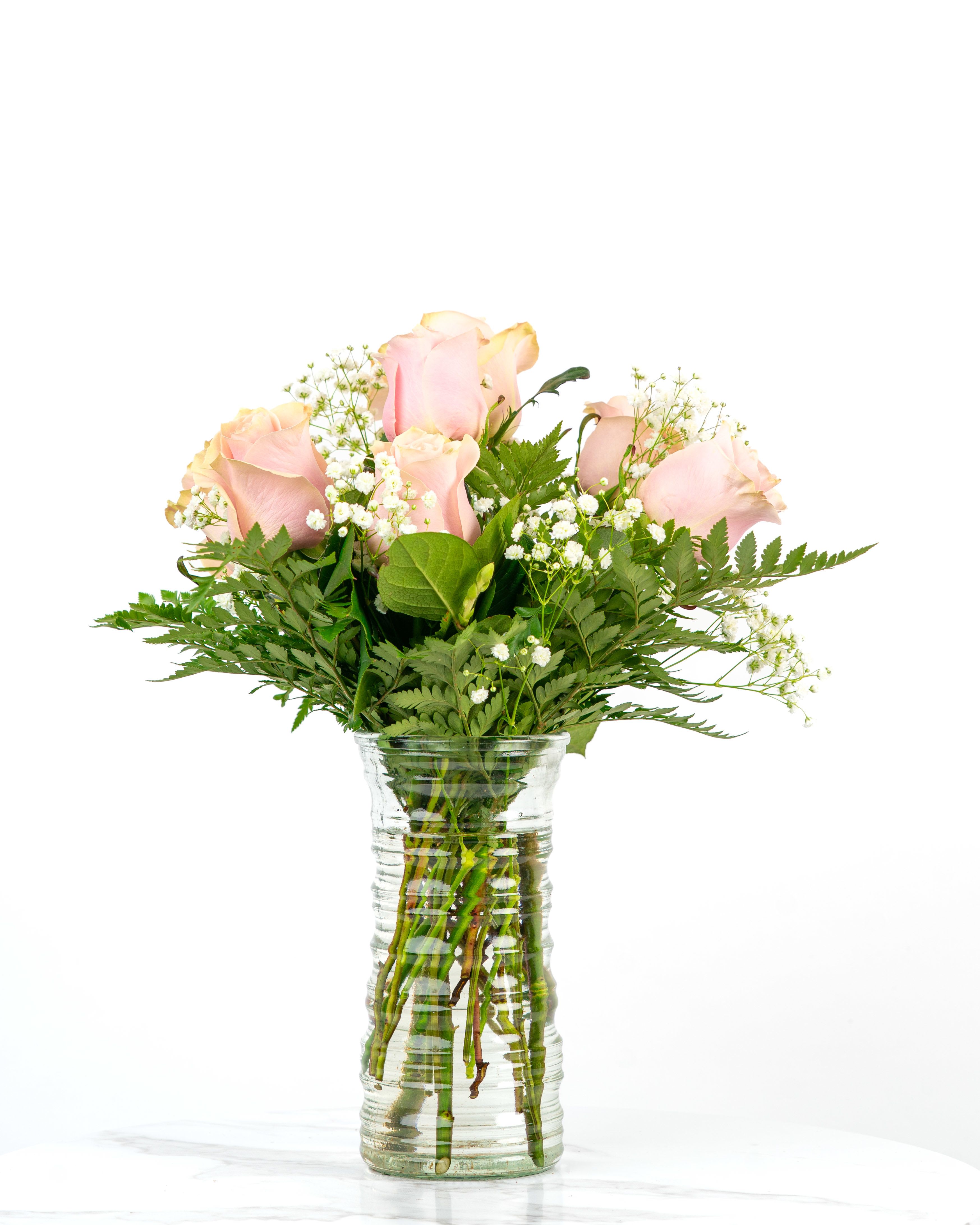 Our Rose Collection: Pink Roses Arrangement - Looking for a classic and feminine arrangement of roses to celebrate someone special?Let us express your cherished love, friendship, and more with a half dozen (standard), dozen (deluxe), or two dozen (premium) pink roses from our Rose Collection.   At Schultz Floral, each arrangement is one of a kind and styled just for your order in our Valparaiso, IN shop. Because we always use the freshest blooms, your final rose arrangement may not look exactly as pictured due to rose variations and availability; our shades of pink may vary week to week. Know that we've gone to great lengths so that our website includes real photography of real blooms within our shop.