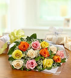 Bouquet of multicolored roses wrapped in clear paper