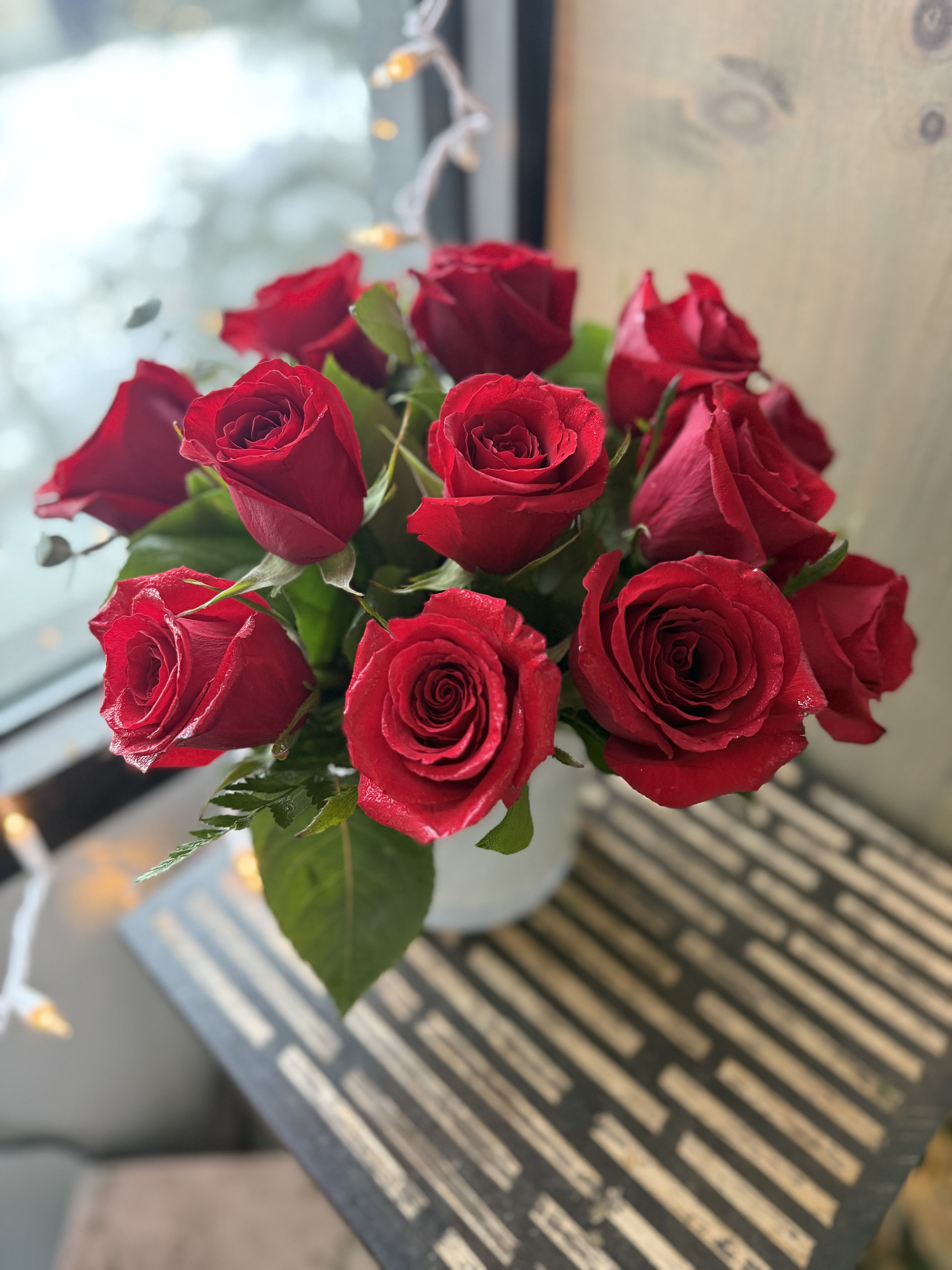 Bouquet of red roses in a white vase