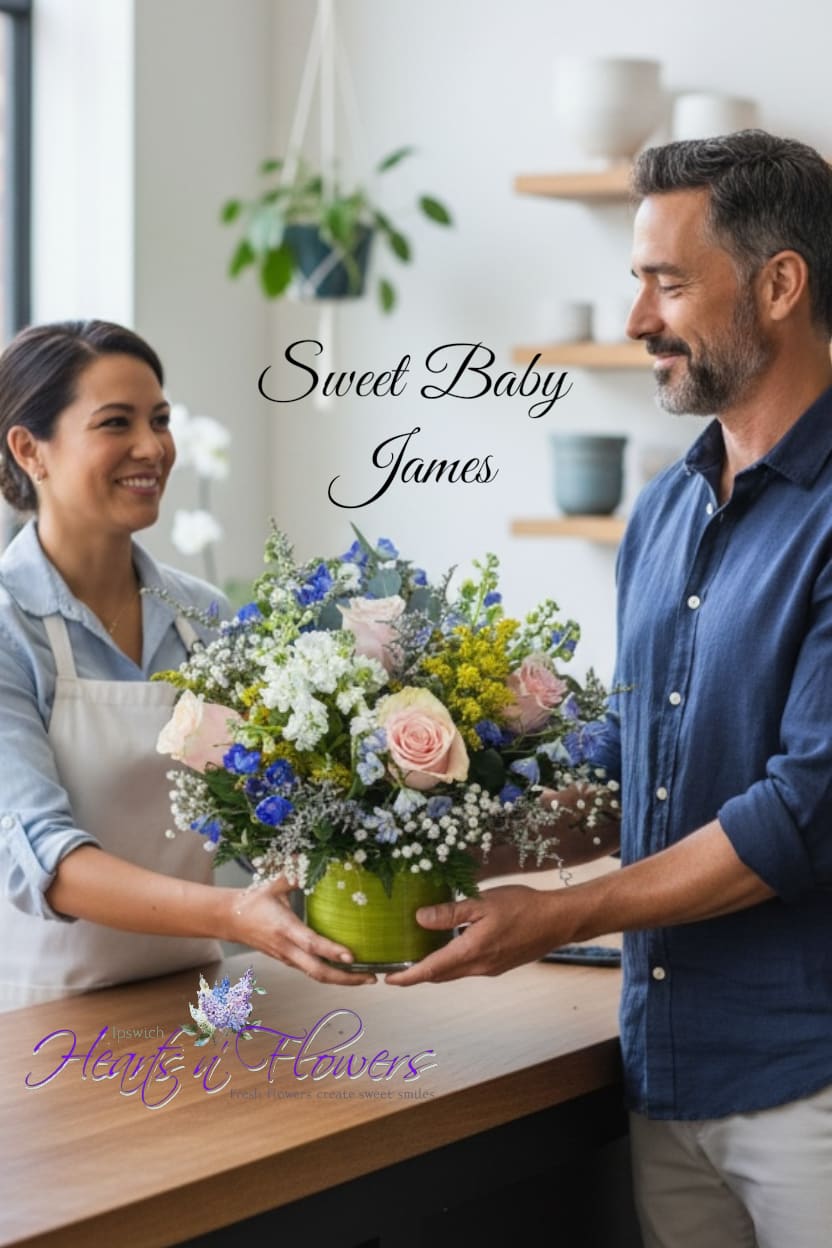 Mixed bouquet in a green vase with pink and blue flowers