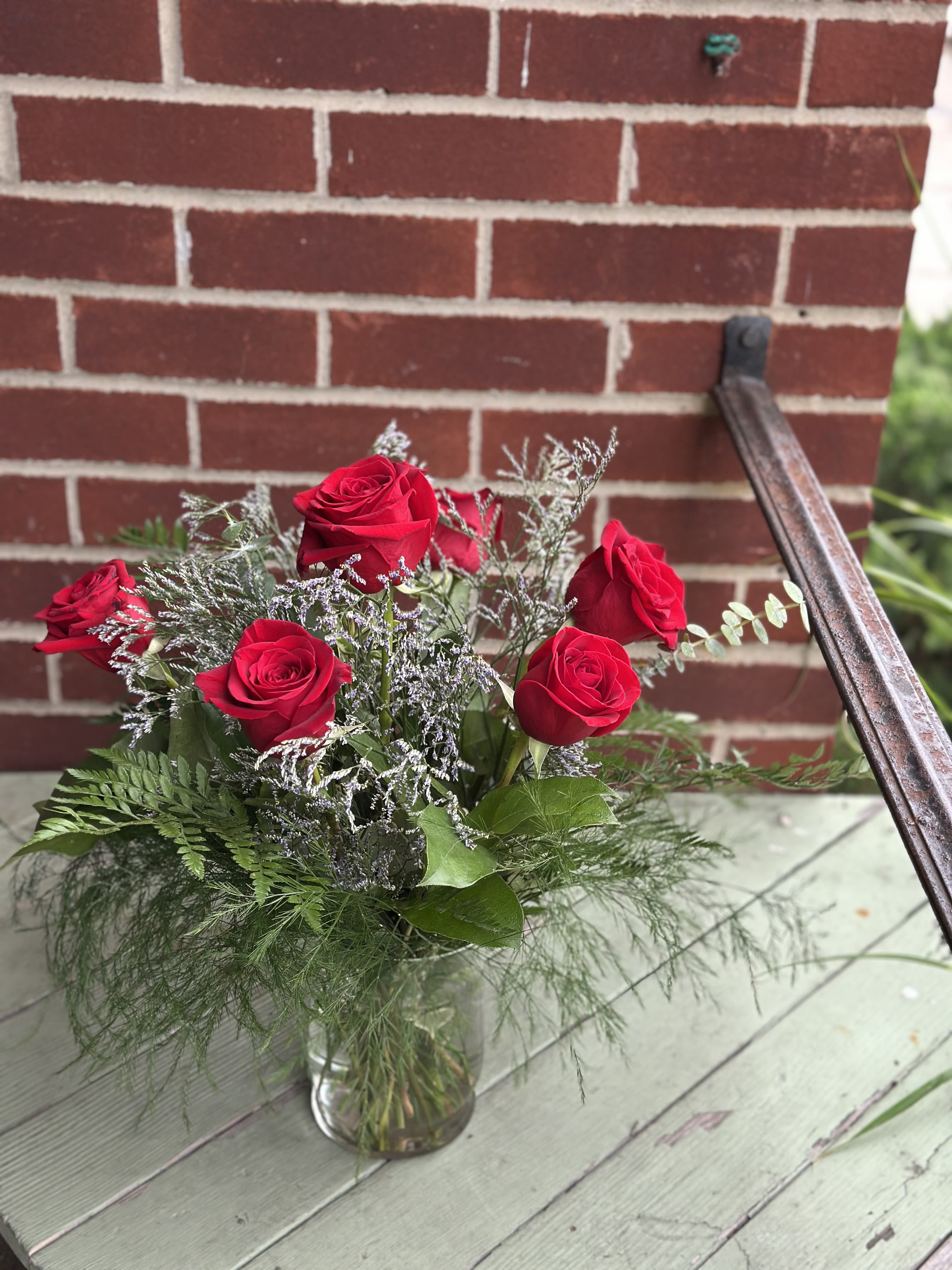 6 Red Roses in A Vase With Plush - Half a dozen red roses in a clear glass vase to say, "Happy Birthday!" or "I Love You!"! *Slight Substitutions may be made, but we maintain the value and integrity of your arrangement.