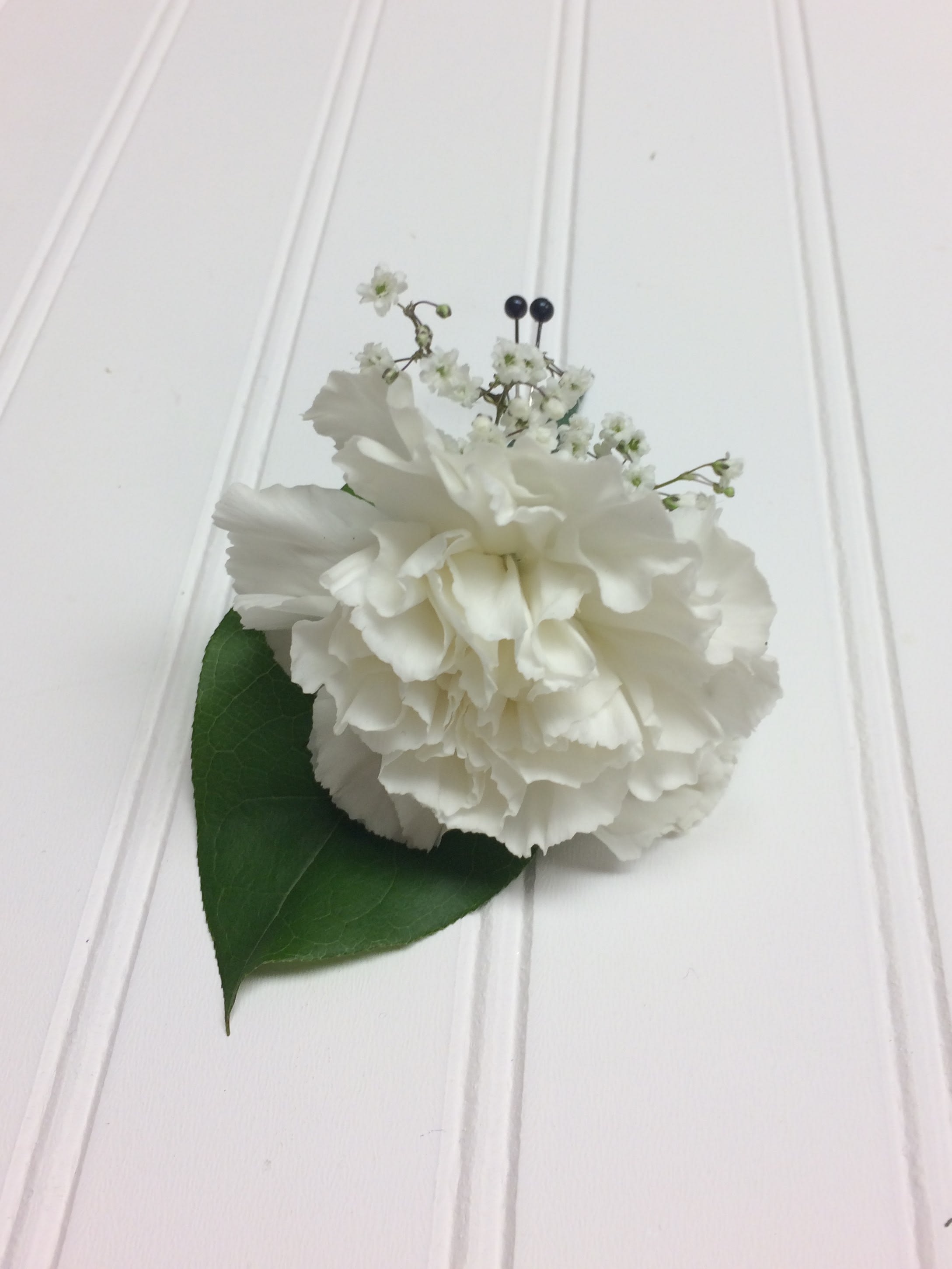 Traditional Carnation Boutonniere - A traditional carnation boutonniere that can be done in any color upon request.