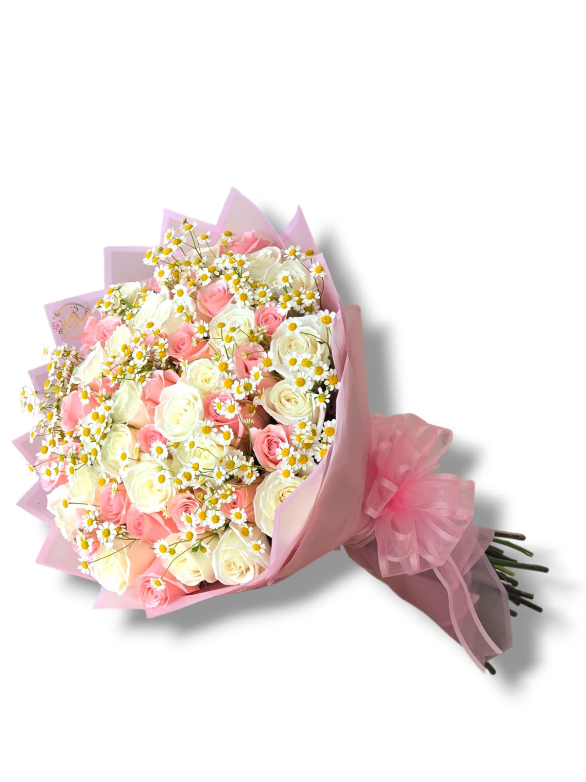 Pink and white rose bouquet with small white daisies wrapped in pink paper