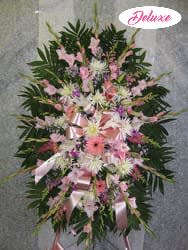 Pink and white floral standing spray with ribbon accents