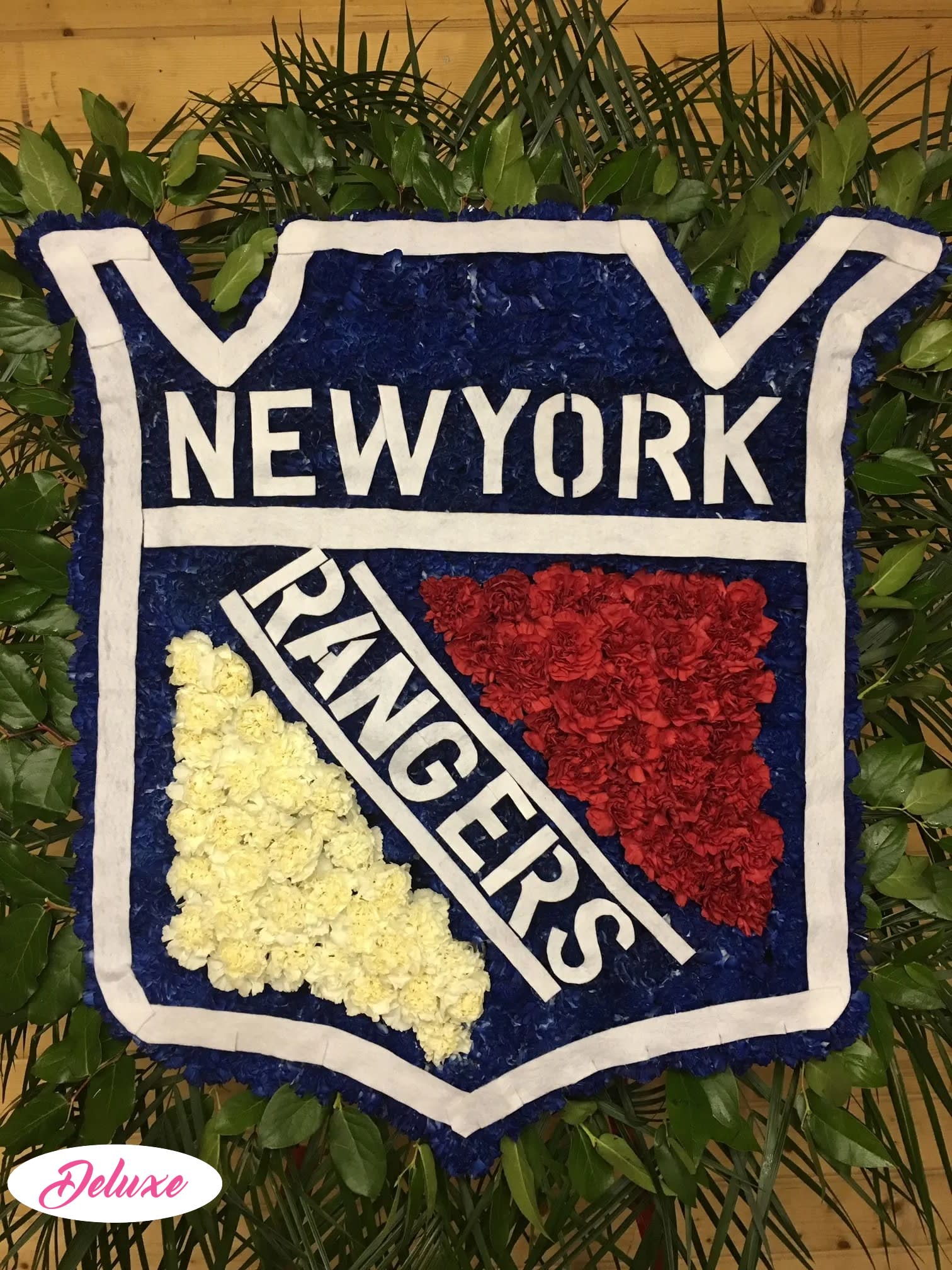 Floral New York Rangers logo arrangement with red, white, and blue flowers