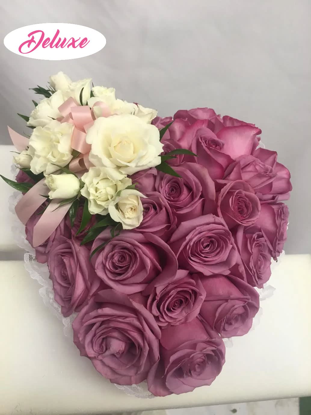 Pink and white rose bouquet with a satin ribbon