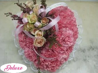 Pink carnation bouquet with cream roses and ribbon