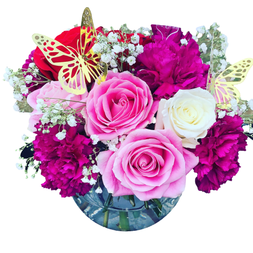 Pink and white roses with magenta carnations in a glass vase