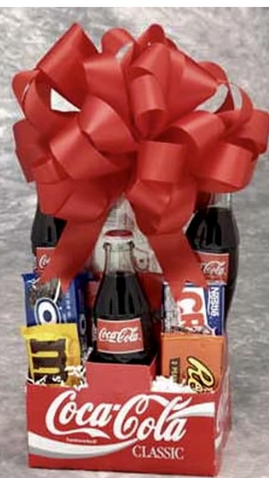 Gift basket with Coca-Cola bottles, candy bars, and a large red bow