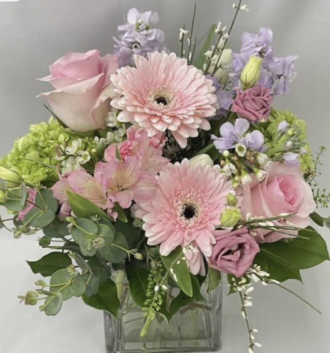Pink and lavender mixed bouquet in a clear glass vase