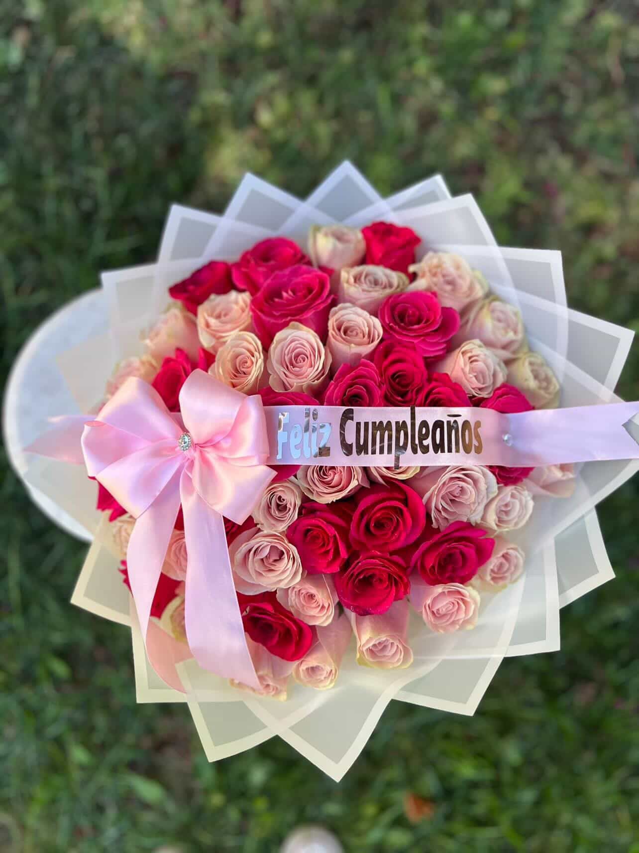 Rosé Celebration Bouquet - The Rosé Celebration bouquet is the ultimate statement of luxury and affection, meticulously designed for those who want to leave a lasting impression. Featuring a lush, hand-tied arrangement of nearly 50 premium roses, this bouquet creates a striking visual harmony between vibrant hot pink and delicate blush tones. This isn't just a gift; it's a breathtaking experience for the recipient who deserves nothing less than the extraordinary.
