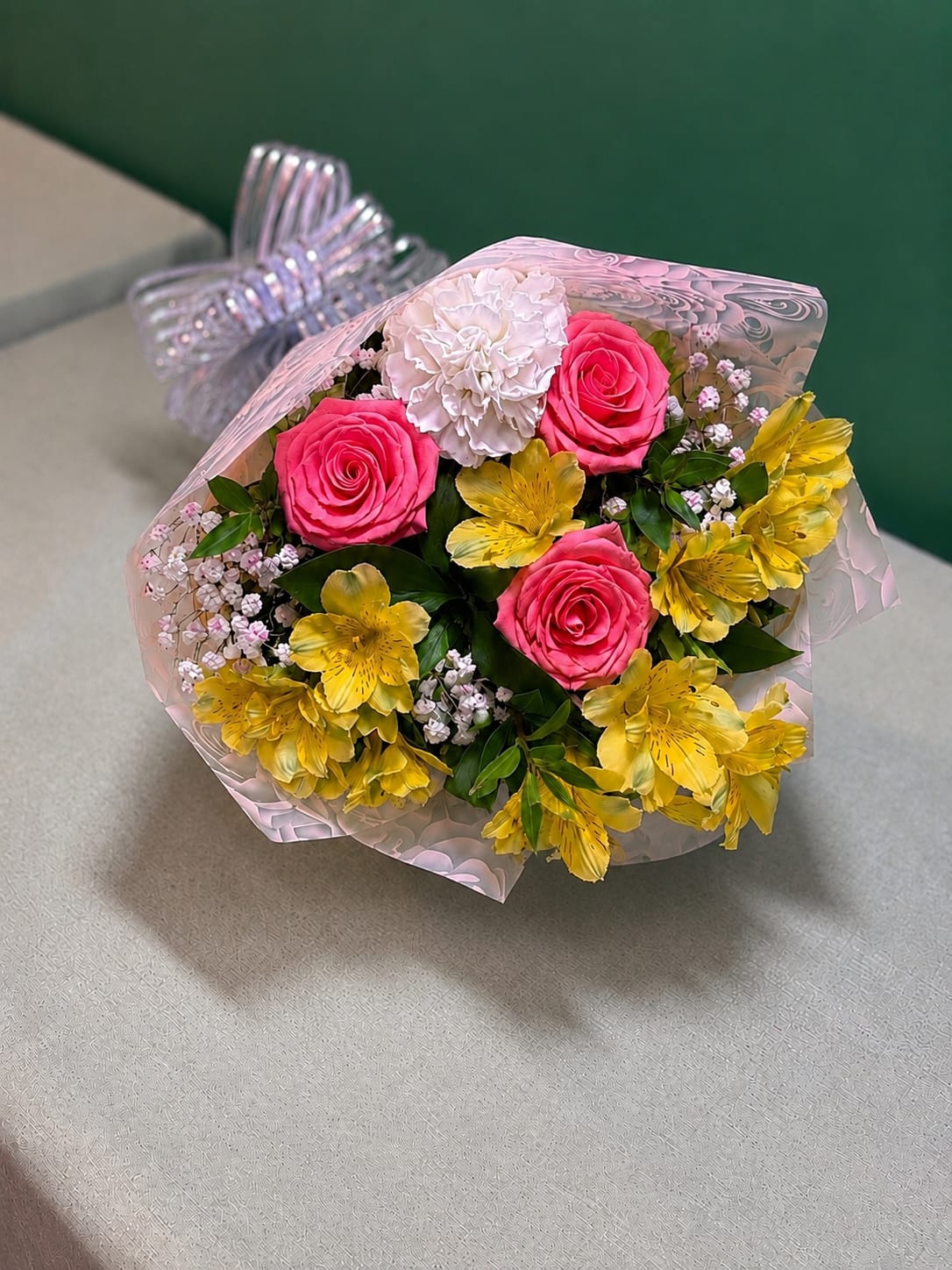 Sunshine Blush Grab &amp; Go - Bright, cheerful, and ready to brighten someone’s day! Our Sunshine Blush Grab &amp; Go features a beautiful mix of fresh seasonal blooms in shades of pink, yellow, and white, accented with lush greenery and wrapped for easy gifting. Flower varieties and colors may vary based on seasonal availability, but every bouquet is designed in the same vibrant, garden-inspired style. Perfect for birthdays, thank-you gifts, or just because.