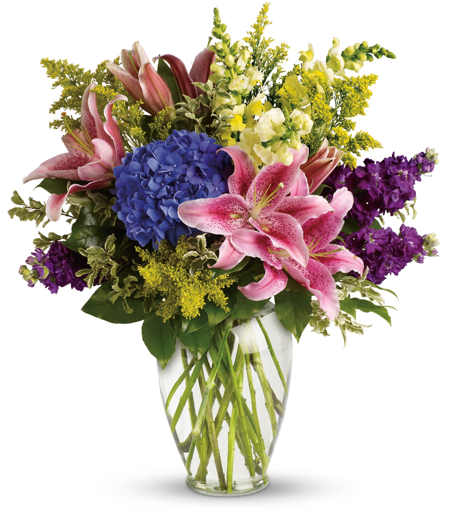 Bouquet of pink lilies, blue hydrangea, and purple flowers in a clear glass vase