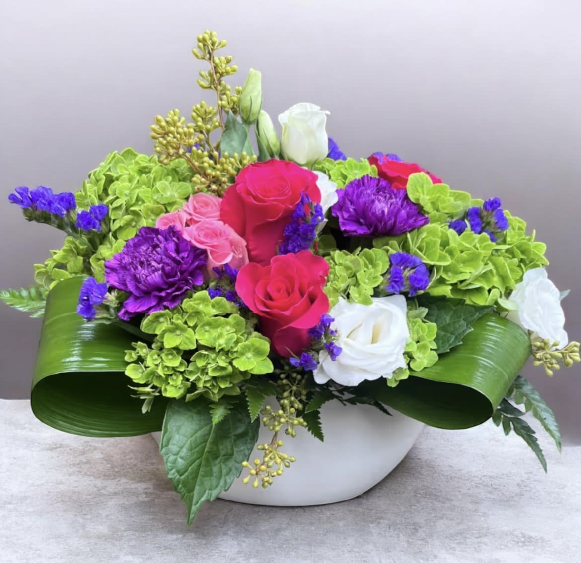Deep Emotions  - This arrangement has hydrangea, roses, lisianthus, carnations, static and beautiful greenery. 