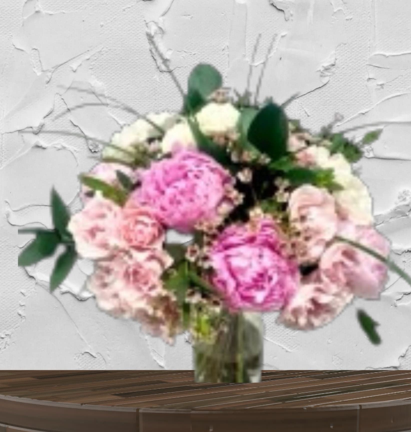 Pink and white bouquet in a glass vase