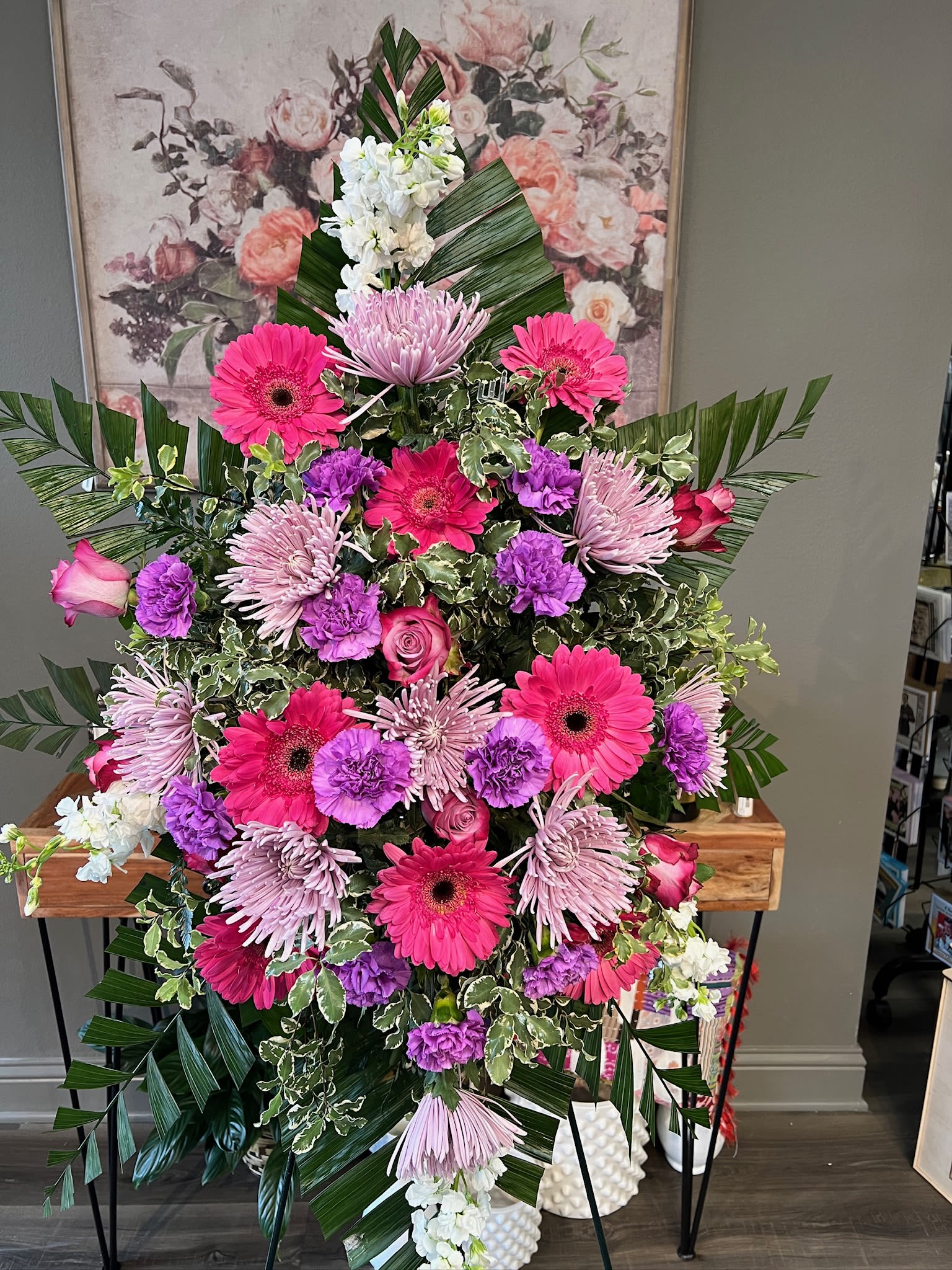 Large standing floral spray with pink, purple, and white flowers