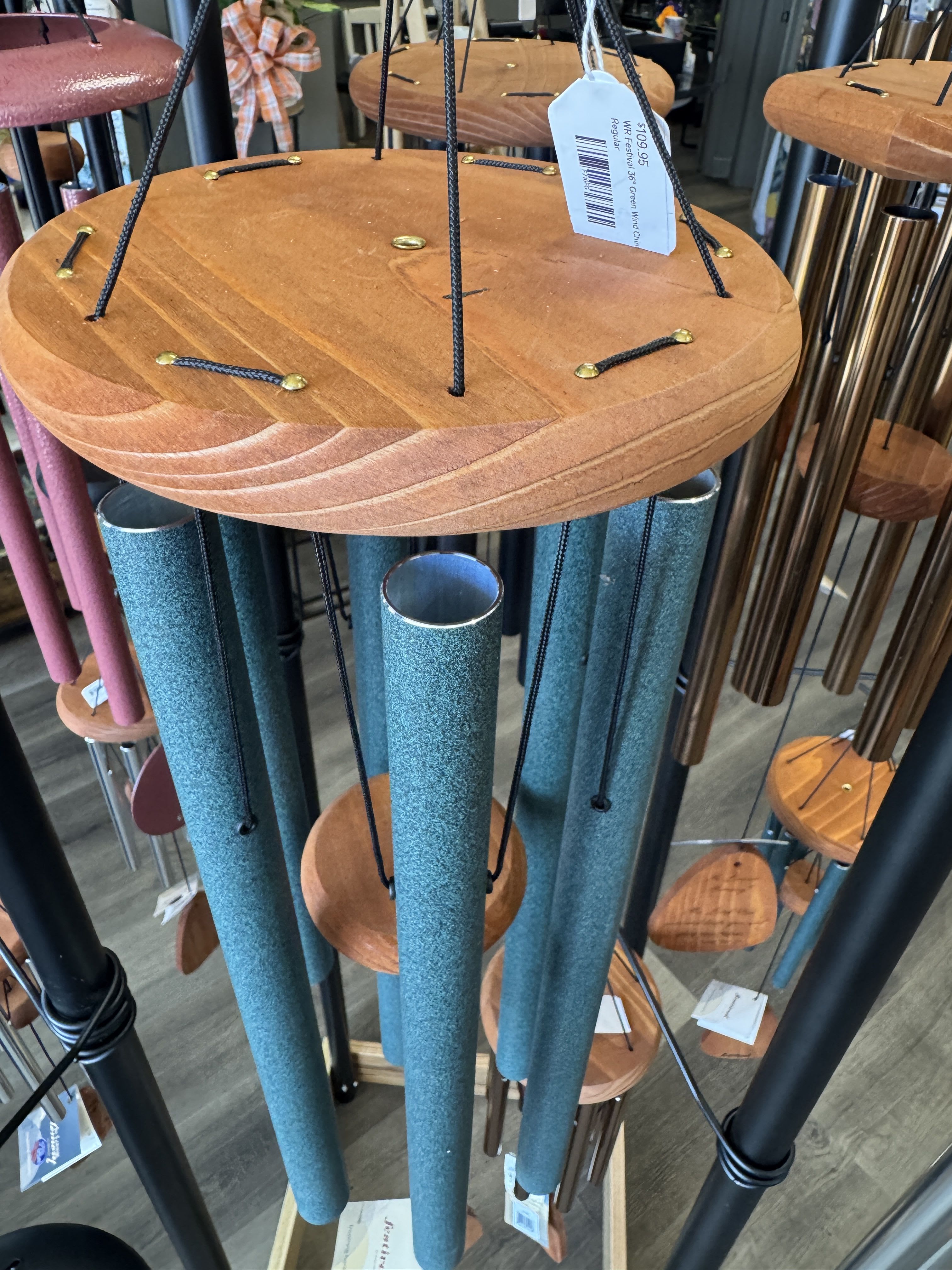 Hanging wind chimes with wooden tops and blue tubes