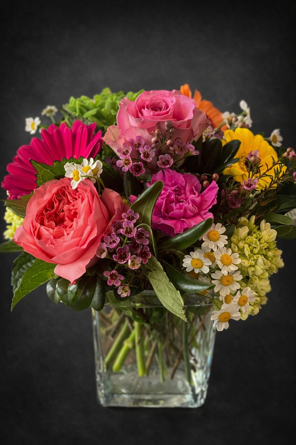 Something Special - A :Just Because" arrangement made with pink roses and matching filler flowers.