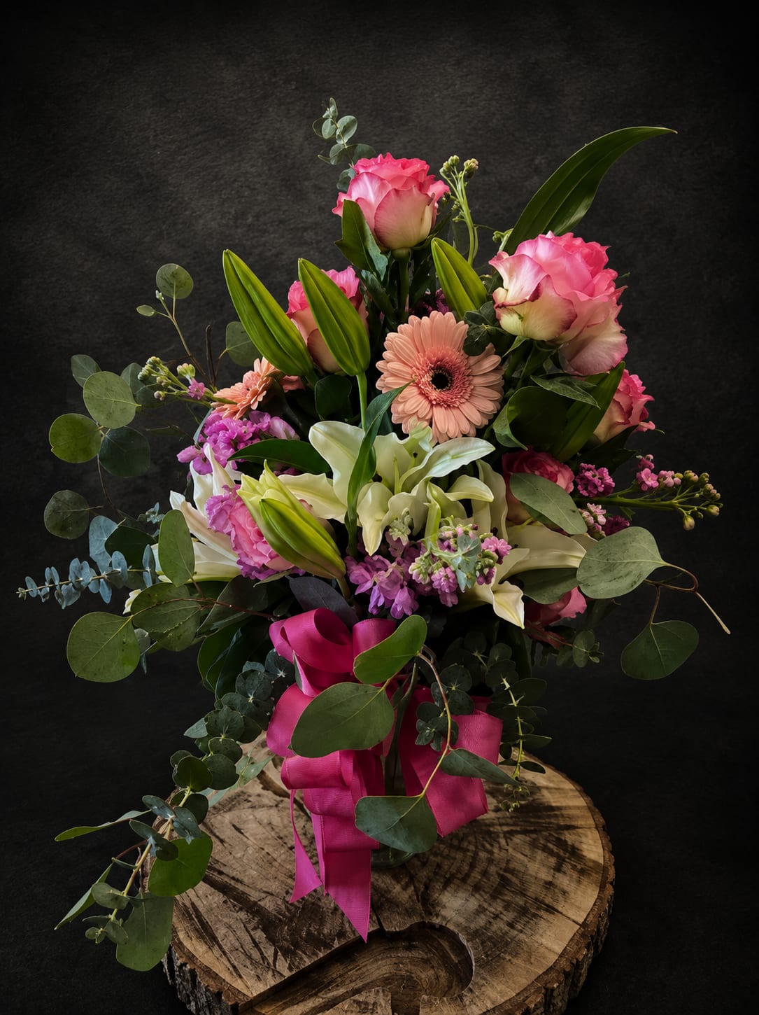 Just Because - A lovely arrangement sent to someone special for any occasion, filled with greenery, pink roses and pink and white filler flowers.