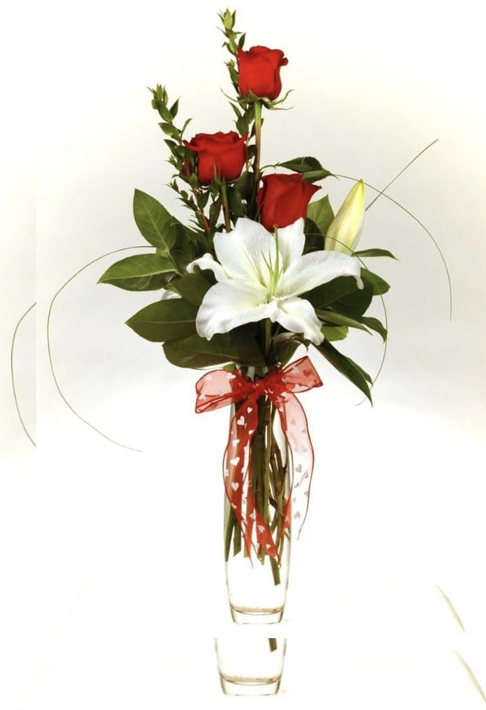 Bud Vase with Lilies - Our traditional bud vase with red roses and a white, starfighter, or pink lily. Lily color varies based on availability. 