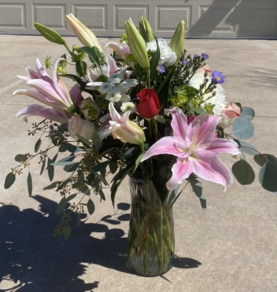 Absolutely Fabulous! - This large beautiful flower arrangement has stargazer lilies, roses, carnations and daisies with greenery that flows and creates a lovely, feminine arrangement perfect for mom!