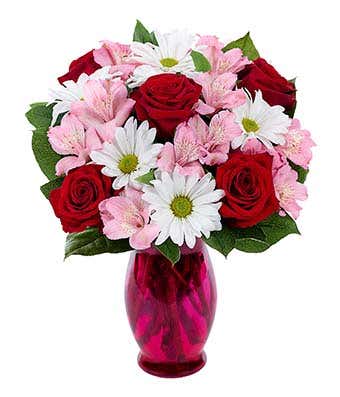 Alstroemeria Romance - A beautiful design filled with a delightful arrangement of spring flowers: alstroemeria lilies, daisies, and roses.  A mixture of greenery completes this special bouquet designed to please any recipient.  