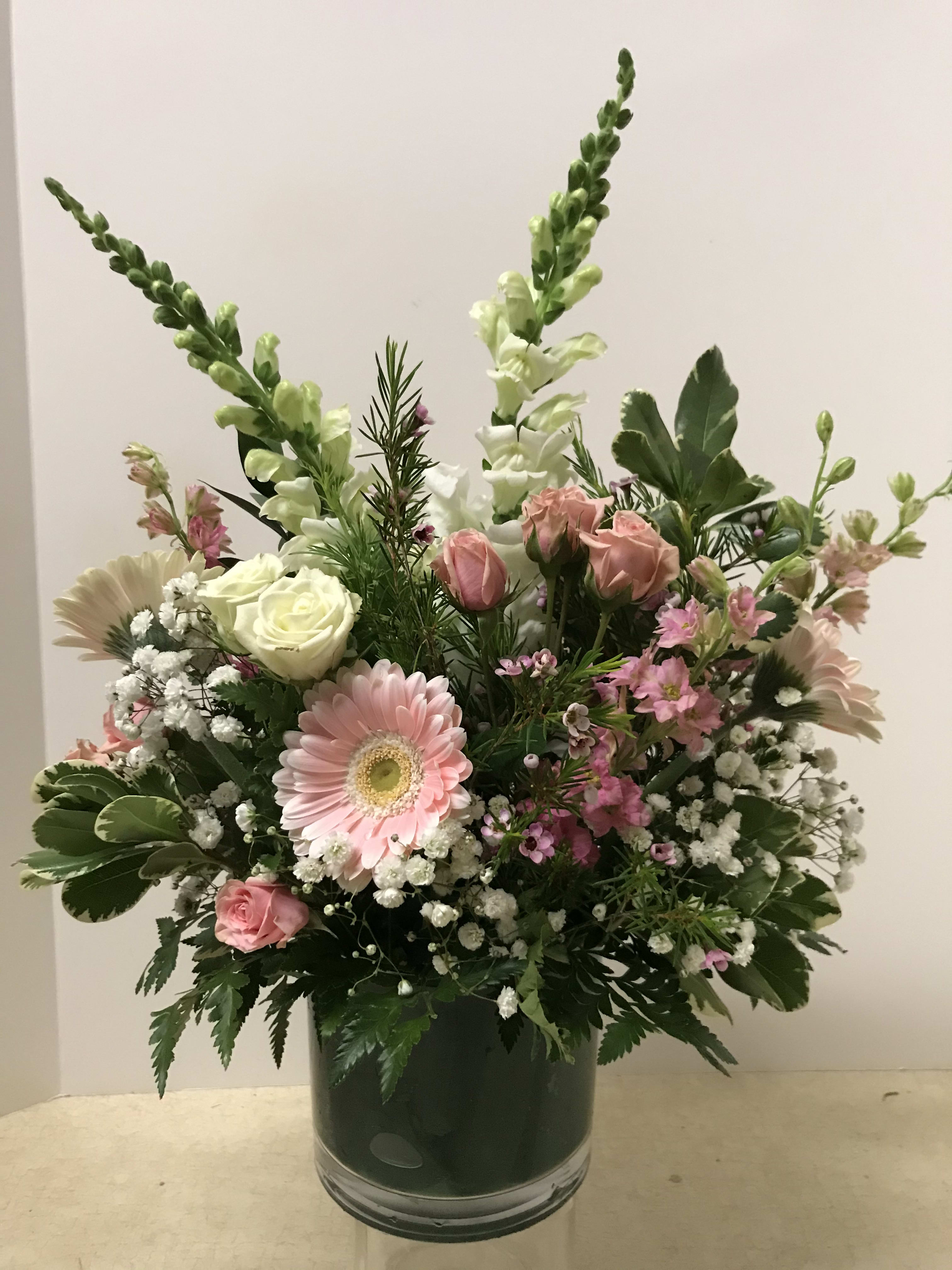 Pink and white mixed bouquet in a glass vase