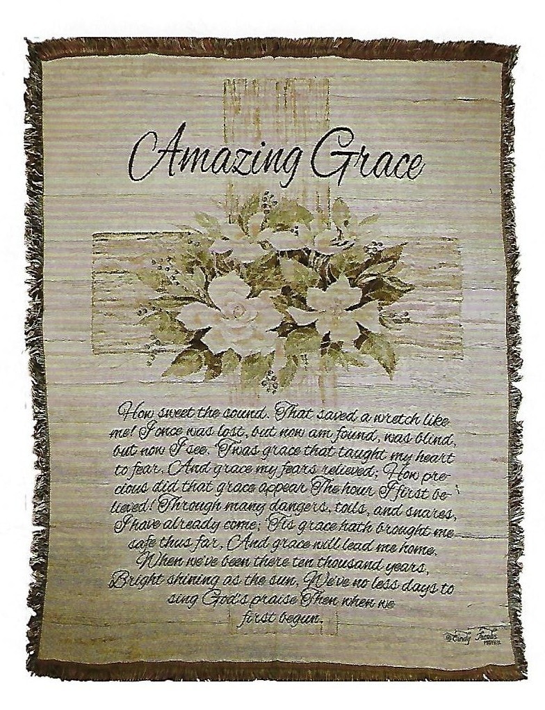 Decorative wall hanging with white flowers and the words Amazing Grace