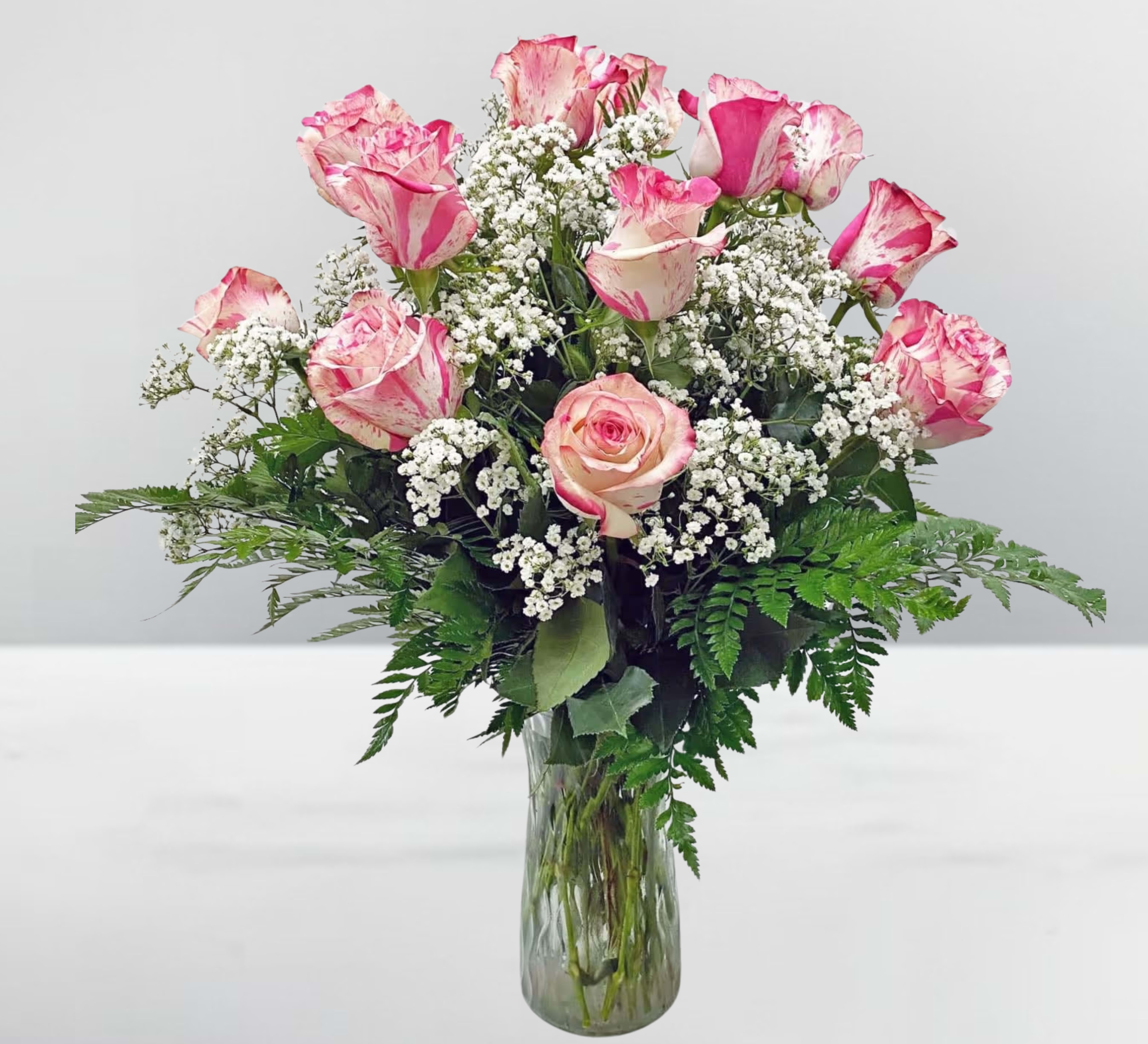 Magic times roses  - A Dozen Magic Times Roses  Make any moment unforgettable with A Dozen Magic Times Roses, a stunning arrangement of 12 exquisite Magic Times roses. These vibrant pink roses, known for their rich color and velvety petals, symbolize admiration, appreciation, and heartfelt affection.  Perfect for anniversaries, birthdays, or simply to brighten someone’s day, this elegant bouquet captures the magic of love and special moments. Arranged with lush greenery for a timeless touch, these roses are a beautiful way to express your deepest feelings and create lasting memories.  Let the Magic Times Roses bring joy, romance, and enchantment to any occasion!