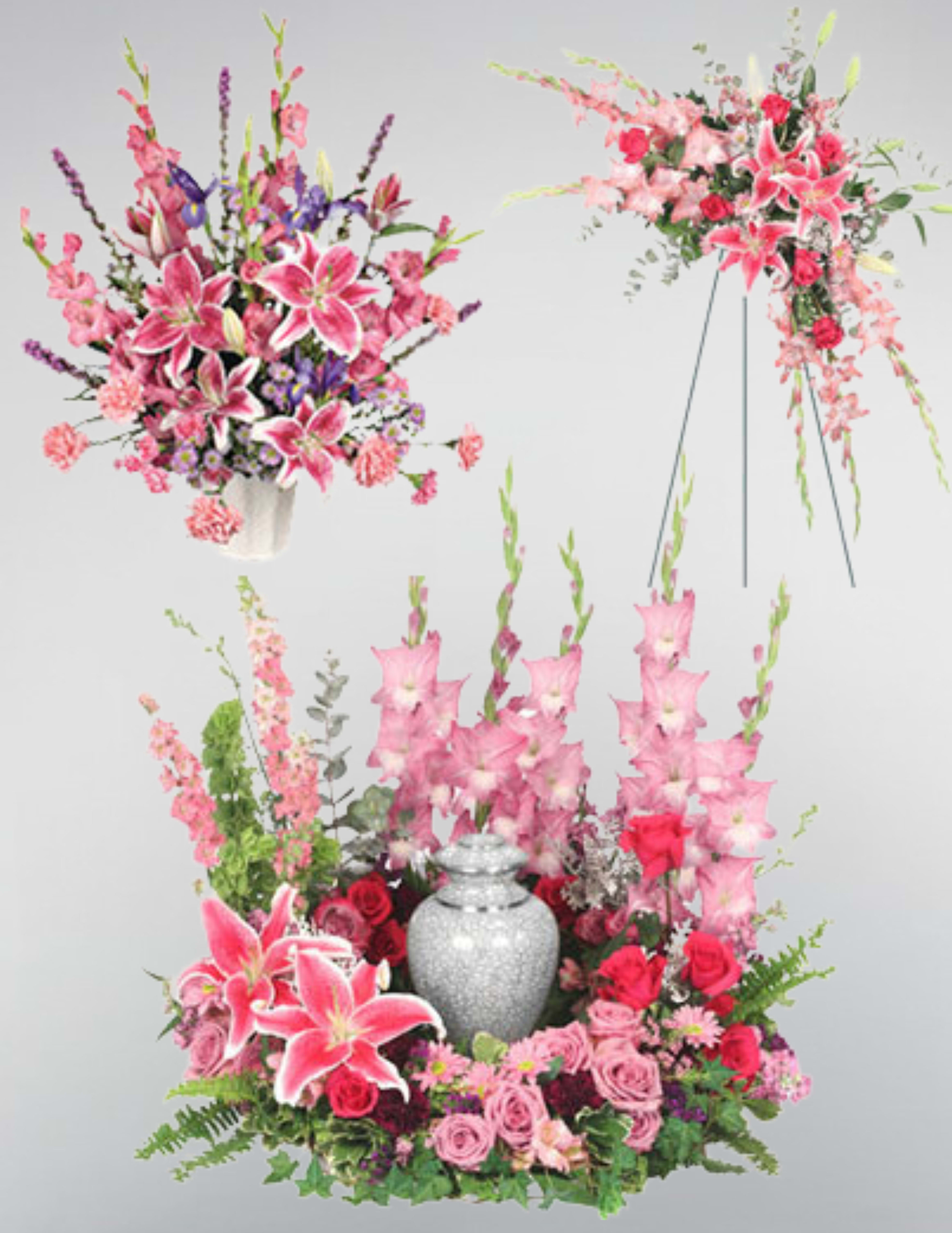 Pink lilies and roses arranged around a silver urn with tall floral sprays