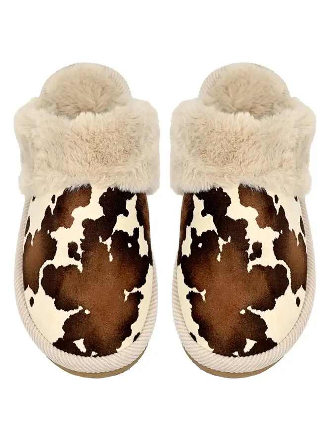 Pair of fuzzy cow-print slippers with cream faux-fur cuffs
