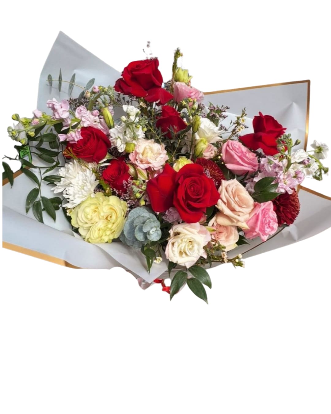 Paris love story - A lush romantic bouquet blending classic red roses, blush and cream roses, lisianthus, ranunculus, chrysanthemums, stock, alstroemeria, eucalyptus, and seasonal greenery. Wrapped in elegant white paper with a gold edge for a luxurious finish. Perfect for anniversaries, proposals, Valentine’s Day, or any moment that deserves something unforgettable.   Note: Certain flowers may be substituted with equal-value seasonal blooms while maintaining the same overall style and color palette.