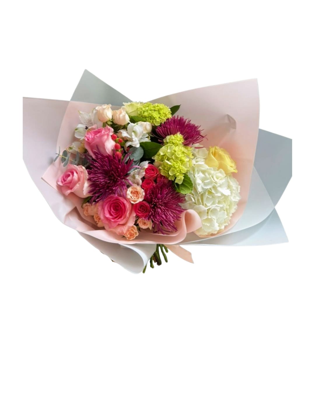 Berry blush - A soft yet striking bouquet blending romantic blush tones with vibrant berry accents. Designed with roses, spray roses, chrysanthemums, hydrangea, alstroemeria, lisianthus, and eucalyptus, wrapped in elegant pale pink and white paper. Perfect for birthdays, anniversaries, or simply a “you deserve something beautiful” moment.  Note: Some flowers may be substituted with equal-value seasonal blooms while keeping the same color palette and style.